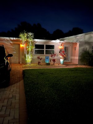 St.pete landscape lighting adds value - This customer spent minimal money to increase the night time curb appeal and make it feel welcoming