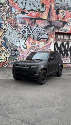 Land Rover Defender Makeover - This Land Rover Defender explains how much a car wrap allows you to completely transform the look of your vehicle. With a wide range of colors, finishes, and textures available, you can create a unique and personalized appearance that suits your style and preferences like this Land Rover. It offers more flexibility than a traditional paint job since wraps can be easily removed or changed if desired, we encourage you to request a quote!