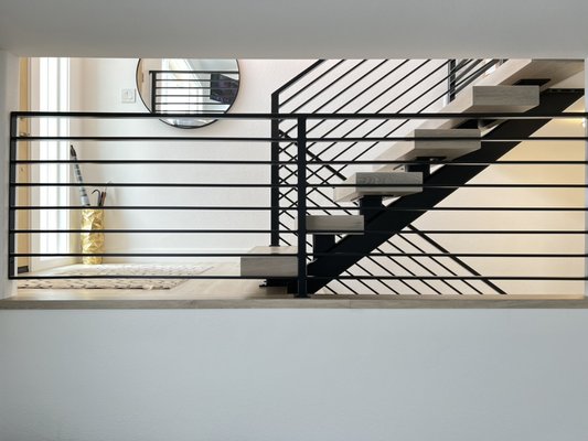 Custom staircase - This project was done to update our staircase in our home. The floating stair really opened up the walkway into our house making it look bigger. Custom staircase - This project was done to update our staircase in our home. The floating stair really opened up the walkway into our house making it look bigger.