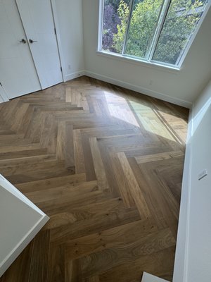 Timeless Perfection - Transform your home with the timeless elegance of herringbone hardwood floors! We recently completed a stunning flooring upgrade for our client, replacing outdated carpet in the bedrooms with beautiful, rich hardwood. The result? A modern, sophisticated look that enhances the warmth and charm of any room. Check out the before and after photos to see the dramatic difference – from carpet to a gorgeous, seamless hardwood design that adds style and value to the space. Ready to elevate your home? Let us bring your vision to life with high-quality hardwood flooring! Timeless Perfection - Transform your home with the timeless elegance of herringbone hardwood floors! We recently completed a stunning flooring upgrade for our client, replacing outdated carpet in the bedrooms with beautiful, rich hardwood. The result? A modern, sophisticated look that enhances the warmth and charm of any room. Check out the before and after photos to see the dramatic difference – from carpet to a gorgeous, seamless hardwood design that adds style and value to the space. Ready to elevate your home? Let us bring your vision to life with high-quality hardwood flooring!