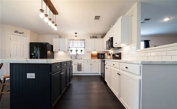 Kitchen remodel - This kitchen remodel included new under cabinet lighting, pendant lighting and outlets on both sides of the island.