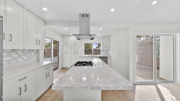 Kitchen & 2 Bathroom Remodeling - Carlsbad - We completed a full transformation in this Carlsbad home, including a kitchen remodel with beautiful white slim shaker cabinets for a clean, modern style. The entire home received light oak luxury vinyl flooring, adding warmth and a fresh updated look throughout.

Both bathrooms were fully remodeled with layout changes to maximize space and improve functionality. We also raised the ceiling in the shower areas to create a more open, spacious feel and upgraded all finishes for a sleek, modern design.

Another successful remodel that brought new life, comfort, and style to this home.