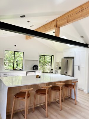 Edmonds Kitchen Remodel - This remodel transformed an outdated kitchen into a bright, open-concept space. The lighter-colored cabinets were chosen to maximize the natural light from the windows, further enhancing the airy feel and bringing new life to the area.