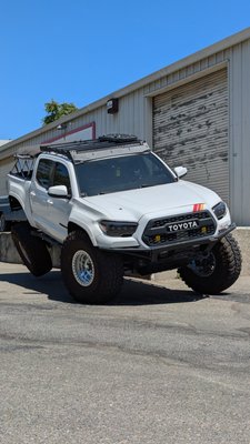 3rd Gen Toyota Tacoma on 40s - This customer is running our bolt on Chevy 63 swap kit in the rear allowing it to cycle 14 inch shocks completely. The front is equipped with a total chaos long travel kit. A lot of clearance and gusseting work needed to be done to run the 40s. Firewall and inner fender tubbing, body mount relocation, cam tab gussets, spindle gussets and upper control arm double sheer. Bumps stop and limit straps set up in the front and rear. Regear to 5.29 gear ration with lockers front and rear. All of this we make happen at our shop 3rd Gen Toyota Tacoma on 40s - This customer is running our bolt on Chevy 63 swap kit in the rear allowing it to cycle 14 inch shocks completely. The front is equipped with a total chaos long travel kit. A lot of clearance and gusseting work needed to be done to run the 40s. Firewall and inner fender tubbing, body mount relocation, cam tab gussets, spindle gussets and upper control arm double sheer. Bumps stop and limit straps set up in the front and rear. Regear to 5.29 gear ration with lockers front and rear. All of this we make happen at our shop