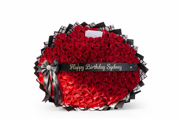 Floral Arrangements - Our portfolio reflects the heart of our work—thoughtfully crafted floral designs that celebrate life’s most meaningful moments. From intimate gestures to grand statements, our collection showcases a diverse range of bouquets, arrangements, and custom creations designed with care, precision, and artistry.

We proudly create bouquets ranging from elegant 25-rose arrangements to breathtaking 200-stem mixed bouquets, each handcrafted to deliver impact, balance, and lasting beauty. Every piece is designed with intention, whether it is a simple expression of love, a milestone celebration, or a large-scale floral statement meant to leave a lasting impression.

Our work features a wide variety of fresh, premium blooms including roses, baby’s breath, seasonal florals, and textured greenery. We carefully select each stem based on quality, color harmony, and longevity to ensure every arrangement looks stunning from the moment it is received and continues to bring joy days later. From soft, romantic palettes to bold and vibrant compositions, our portfolio highlights versatility while maintaining a refined, timeless aesthetic.

Customization is at the core of what we do. No two arrangements are ever the same. Each bouquet is thoughtfully tailored to reflect the occasion, personality, and vision of our clients. Whether it’s a classic rose bouquet, a modern mixed arrangement, or an elaborate floral piece designed for a special event, we approach every order with the same level of dedication and craftsmanship.

Our larger arrangements—ranging up to 200 stems—are designed to make unforgettable statements. These pieces are ideal for celebrations, proposals, anniversaries, grand gestures, and events where impact matters most. Despite their size, every large bouquet maintains structure, elegance, and balance, showcasing our attention to detail and design expertise.

At the same time, our smaller arrangements remain just as meaningful. A 25-rose bouquet or a modest mixed arrangement is crafted with the same care, quality, and artistic intention as our largest designs. We believe that beauty is not defined by size alone, but by the thought, emotion, and skill behind each creation.

Our portfolio represents more than flowers—it reflects passion, family values, and a commitment to excellence. Every arrangement is handcrafted with pride, guided by creativity and fueled by a genuine love for floral artistry. Whether you are browsing for inspiration or selecting the perfect bouquet, our work is designed to speak for itself—elegant, heartfelt, and unforgettable.