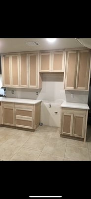 Painting of new kitchen cabinets. - The kitchen cabinets after being painted with these beautiful evo paint from Kelly Moore in satin. A lot of prepping and preparation was involved in the painting of these cabinets.Customer was very satisfied with the transformation.