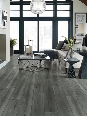 Vinyl Flooring - Vinyl flooring is most known for its impressive durability and ease of maintenance. It stands up to heavy foot traffic and helps reduce noise. This makes it able to stand up to even the toughest family lifestyle, whether you have pets and/or children. Additionally, vinyl flooring provides a comfort for your feet that doesn’t always come with other floors. It’s also resistant to water, mildew, and stains. Liquid stays on the surface and is easily wiped away, so spills are never a big problem to clean up. Vinyl Flooring - Vinyl flooring is most known for its impressive durability and ease of maintenance. It stands up to heavy foot traffic and helps reduce noise. This makes it able to stand up to even the toughest family lifestyle, whether you have pets and/or children. Additionally, vinyl flooring provides a comfort for your feet that doesn’t always come with other floors. It’s also resistant to water, mildew, and stains. Liquid stays on the surface and is easily wiped away, so spills are never a big problem to clean up.