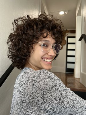 Curls Galore - If you’re looking for someone who specializes in curly/natural hair look no further. Ashley is our curly hair specialist. She has extensive knowledge and training with Deva Cut as well as Rezo cuts. As a curly girl herself she knows the struggles you can have but she prides herself on educating her guests so that they leave with the knowledge and products to truly transform their curls. Curls Galore - If you’re looking for someone who specializes in curly/natural hair look no further. Ashley is our curly hair specialist. She has extensive knowledge and training with Deva Cut as well as Rezo cuts. As a curly girl herself she knows the struggles you can have but she prides herself on educating her guests so that they leave with the knowledge and products to truly transform their curls.