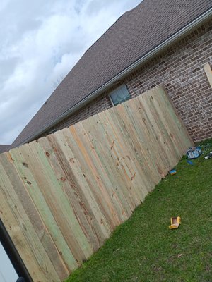 Fence Repair - Here is a customer who needed a goof stretch of fence that was rotten and broken. we tore down the bad wood and even fixed the sagging gate.