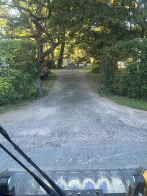 Customer saved thousands by repairing their driveway with recycled asphalt millings over re-paving in new blacktop. - This Customer wisely chose to repair their old crumbling asphalt driveway using recycled asphalt millings at a fraction of the price of hot asphalt paving. We started by scraping out any weeds growing through the old driveway surface, then spread out about 15 tons of asphalt millings on this customers driveway and compacted them in with our asphalt roller. This customer will have a solid driveway for years to come a tenth the cost of traditional asphalt, and it’s better for the environment. Customer saved thousands by repairing their driveway with recycled asphalt millings over re-paving in new blacktop. - This Customer wisely chose to repair their old crumbling asphalt driveway using recycled asphalt millings at a fraction of the price of hot asphalt paving. We started by scraping out any weeds growing through the old driveway surface, then spread out about 15 tons of asphalt millings on this customers driveway and compacted them in with our asphalt roller. This customer will have a solid driveway for years to come a tenth the cost of traditional asphalt, and it’s better for the environment.