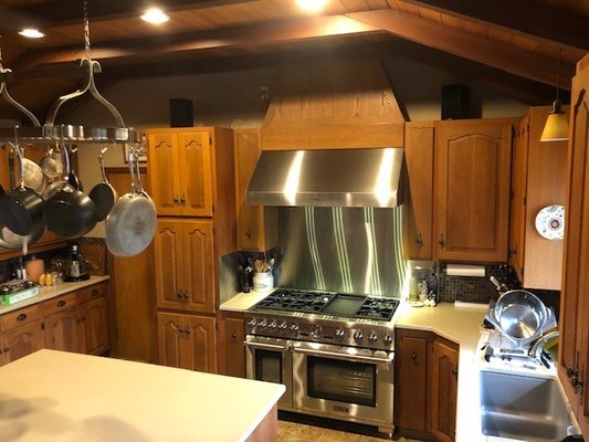 Kitchen cabinet remodel 2020 (custom) - Remove specific parts of the cabinets to make ready for new free standing gas stove. custom cabinetry and doors to accommodate not changing the whole kitchen cabinets. Custom Hood cover.