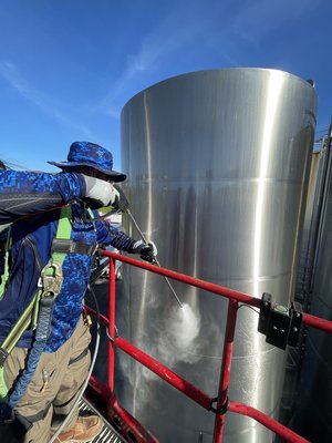 heavy-duty silo pressure washing - Heavy-duty silo power washing with hot water involves using high-pressure, heated water to thoroughly clean and sanitize silo interiors and exteriors. This process removes built-up residues, contaminants, and debris, ensuring optimal hygiene and operational efficiency for storage facilities. The hot water effectively breaks down tough grime and biofilm, providing a deeper and more effective clean compared to cold water washing. Call us at 619-395-6587