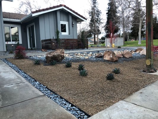 Desert Landscapes - Drought tolerant landscaping can either be performed with rock or mulch. There are also plants or succulents laid along the ground with a drip system that controls  the flow of water.