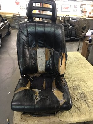 Broken and torn seat restoration - This seat came out of an older Volvo that was in great condition when it came to the motor and body of the car. However, the interior left a lot to be desired. Broken and torn seats needed extensive repairs. But with a little magic we got this vehicle looking factory fresh.