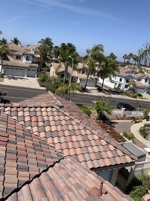 Eagle Capistrano tile roof in vista 
(color: San Ramon) - We removed the old tile, installed all new fascia and filled in an entry way with shiplap. Then installed beautiful Eagle concrete tile.