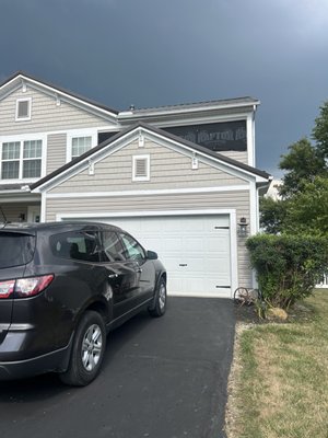 SIDING - Siding wind damage, installed vapor barrier and new siding above the garage