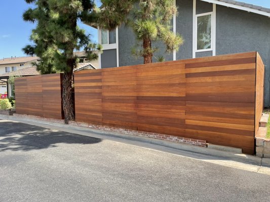 Horizontal Red Balau fence - Beautiful Horizontal Red Balau hardwood fence in the city of Placentia. Added a clear stain to accentuate the beautiful natural tones of the wood. Horizontal Red Balau fence - Beautiful Horizontal Red Balau hardwood fence in the city of Placentia. Added a clear stain to accentuate the beautiful natural tones of the wood.