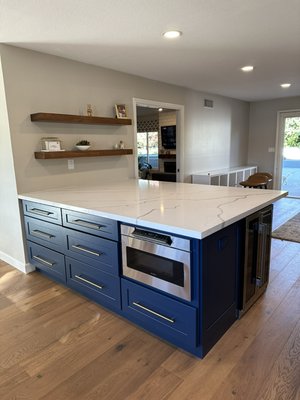 Beautiful Claremont Kitchen Remodel!!
White Shaker Surround cabinets with Blue Shaker Island!
Quartz Calacata Laza! - This kitchen remodel was a complete turnaround for our clients! We eliminated walls, changed floor plan of stove, relocated garage interior door and removed old soffit! The overall goal was expansion of cabinet layout for more space and seating for entire family to be able to utilize kitchen for family time and eating as a whole! Beautiful Claremont Kitchen Remodel!!
White Shaker Surround cabinets with Blue Shaker Island!
Quartz Calacata Laza! - This kitchen remodel was a complete turnaround for our clients! We eliminated walls, changed floor plan of stove, relocated garage interior door and removed old soffit! The overall goal was expansion of cabinet layout for more space and seating for entire family to be able to utilize kitchen for family time and eating as a whole!