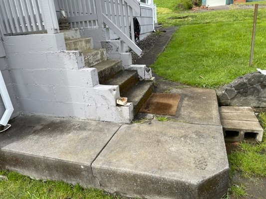 Staircase Repair - These old stairs were in bad shape. They were slippery and uneven, creating a fall hazard. We removed some of the existing material and poured new concrete. Coming up next are new handrails to complete the fresh look. Staircase Repair - These old stairs were in bad shape. They were slippery and uneven, creating a fall hazard. We removed some of the existing material and poured new concrete. Coming up next are new handrails to complete the fresh look.