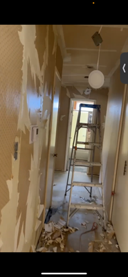 Wallpaper removal - Peeling back the past, revealing a brighter and smoother space underneath. Wallpaper removal - Peeling back the past, revealing a brighter and smoother space underneath.