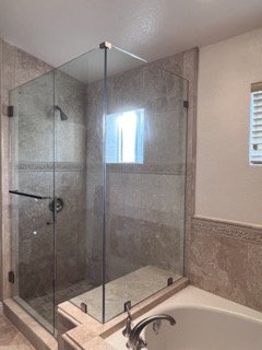 Custom Frameless Shower Doors - Get ready to be mesmerized by the sheer beauty of our latest masterpiece—a luxurious custom frameless shower door that we recently installed for a delighted client. Prepare to step into a world of pure indulgence! 
This stunning frameless shower door is a testament to sophistication and craftsmanship. Its seamless design creates an illusion of space, allowing natural light to cascade through, while its sleek lines and exquisite details add a touch of modern elegance to any bathroom.