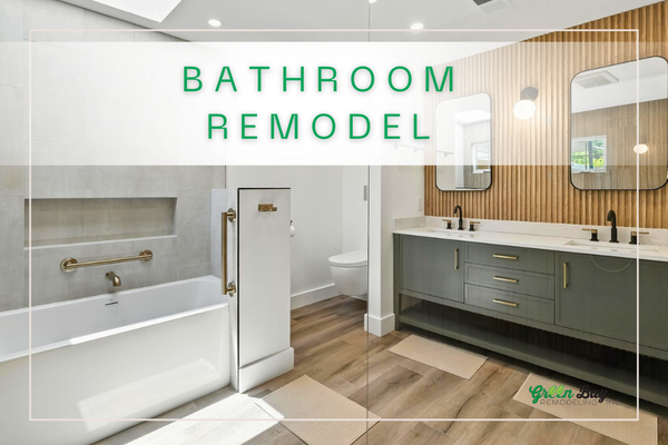 Modern Bathroom Remodel | Green Bay Remodeling - This modern bathroom remodel features a custom sage green double vanity with sleek brass hardware and matte black fixtures for a clean, elevated look. A warm wood slat accent wall adds texture and depth, perfectly complementing the bright white quartz countertop and framed mirrors. Thoughtfully designed for both style and function, this space feels fresh, inviting, and built to last.