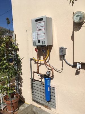 Tankless Water heater Install - Replaced a 40 gallon water heater in metal enclosure outside of house with a Takagi tankless water heater. When a water heater is already outside of a house with a raised floor, it is much easier to replace with a tankless. This is the second one I have replaced on the property. I did the same replacement on a granny flat located behind this house a few years ago. Tankless water heaters work the best when located outside. All my tankless installations are outside of the house. They work so much more efficiently, safer and easier to service. If you were to look at the Takagi web site you would also see I am also there as a warranty company. Tankless Water heater Install - Replaced a 40 gallon water heater in metal enclosure outside of house with a Takagi tankless water heater. When a water heater is already outside of a house with a raised floor, it is much easier to replace with a tankless. This is the second one I have replaced on the property. I did the same replacement on a granny flat located behind this house a few years ago. Tankless water heaters work the best when located outside. All my tankless installations are outside of the house. They work so much more efficiently, safer and easier to service. If you were to look at the Takagi web site you would also see I am also there as a warranty company.