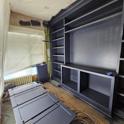 Seattle's Best Cabinet Painters - Interior wall painting with a built-in bookshelf.