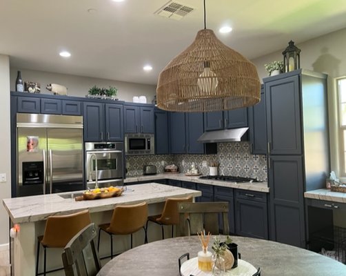Blue Kitchen Cabinet Refacing Project in Scottsdale - On this kitchen project, we refaced the client's existing boxes with brand new, made-in-America doors, drawers and 1/4' wood face frames in this beautiful hale navy blue.