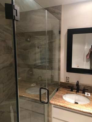 Neo Angle Frameless Shower Door - Corner Enclosure - Installation - Encinitas - 2021 - Neo Angle Frameless Shower Door Installation - Corner Enclosure - Black Hardware - Encinitas - 2021