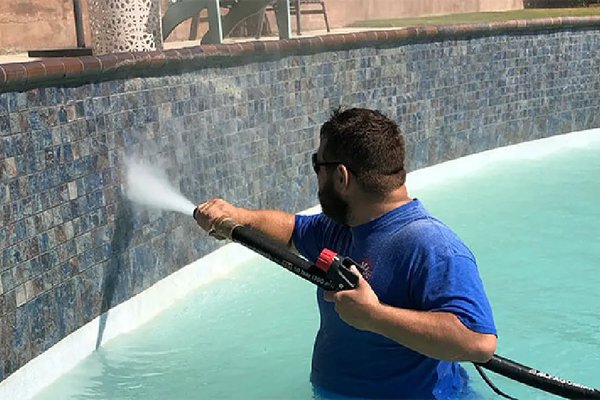 Power washing pool tiles - Pressure washing pool tiles effectively removes built-up grime, calcium deposits, and algae, restoring their original shine. The high-pressure water stream safely blasts away tough stains without damaging the surface, leaving your pool looking refreshed and clean!  
!