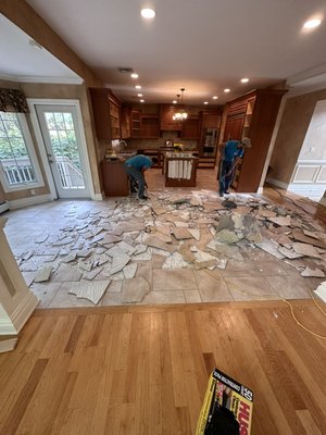 Kitchen removal - This was done in the kitchen that the owner hates the tile .