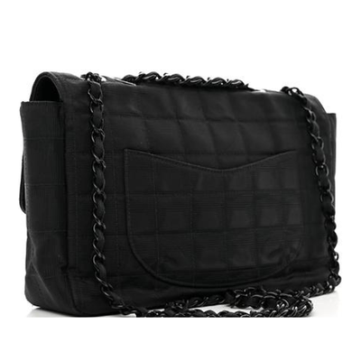 CHANEL Nylon Medium Travel Flap - This is an authentic CHANEL Nylon Medium Travel Flap in Black. This stylish shoulder bag is beautifully crafted of textured black nylon with Chanel CC logos embroidered throughout. The bag features a black chain nylon threaded shoulder strap, a rear pocket, and a frontal flap with a CC turn-lock. This opens to a black satin fabric interior with zipper and patch pockets.