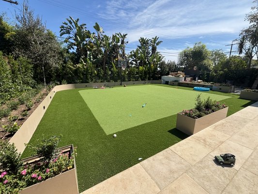Custom project - This is a residential backyard with a Putting Green doubling as a sport court surrounded with our natural blend.