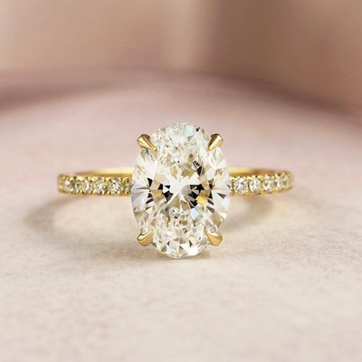 Oval diamond engagement ring - We custom made this beautiful oval diamond engagement ring from scratch. Hand selecting all the side diamonds to match the center perfectly!