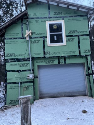 Siding renovation - This renovation was on an old barn that desperately saving, we tore the old siding and sheathing off.  Framed in new windows and installed zip sheathing, windows, doors and siding all the way around. Barn is prepped and ready for paint in the spring.