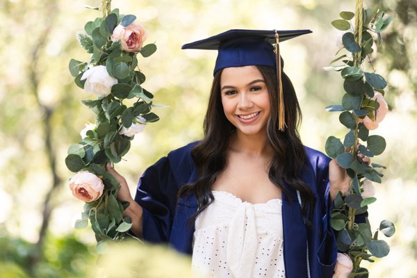 Senior portraits - I can do senior portraits (cap and gown) with a plain backdrop or outside. I have several fun locations. I have a lot of seniors bring their varsity jackets, props and some just want them in plain clothing as you'll see in my photos here
