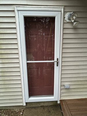 New trim and new storm door - New trim around door and new storm door