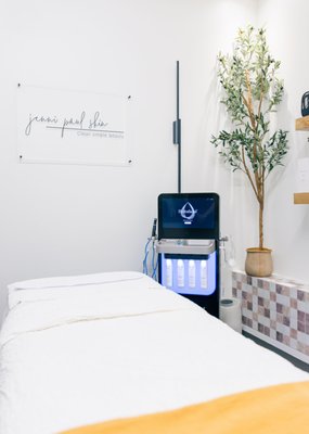 Deluxe Hydrafacial - The Deluxe Hydrafacial offers a luxurious skincare experience that deeply cleanses, exfoliates, and hydrates the skin. Infused with potent serum filled boosters tailored to individual skin concerns, and professional strength therapeutic light energy to treat skin from within, this treatment leaves the complexion radiant and rejuvenated.