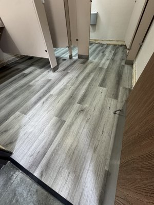 Restroom renovation - We gave this restroom a much needed upgrade. Ripped out the old, worn out floors and installed clean, durable LVP that can handle daily traffic and still look great. If your business space could use a refresh, Coastline Flooring Inc is here to help!