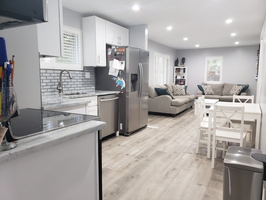 kitchen/Livingroom remodel - This was a full remodel we put in the floors and backsplash and baseboards and drywall that the customer picked out.