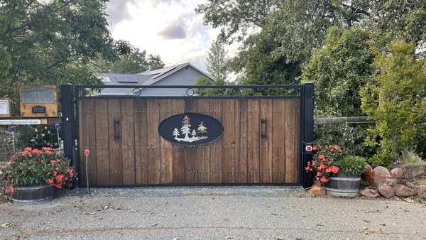 Penn Valley Driveway Gate - Our customer lives in a more remote area and they wanted a gate for security and aesthetics. They really wanted the wood look with a mountain cutout. This gate has been in place for almost 9 years and it still operates like new! Penn Valley Driveway Gate - Our customer lives in a more remote area and they wanted a gate for security and aesthetics. They really wanted the wood look with a mountain cutout. This gate has been in place for almost 9 years and it still operates like new!