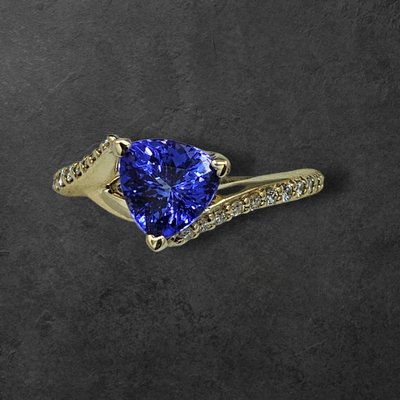 Tanzanite and Diamond Ring - Beautiful trillion cut tanzanite on diamond accented band Tanzanite and Diamond Ring - Beautiful trillion cut tanzanite on diamond accented band