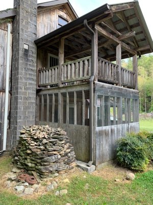 Cabin Exterior Refinishing - This beautiful family cabin in the mountains of North Carolina was built by hand from trees on the property. The lumber was beautiful and structural but in need of some refinishing and tlc. It had been at the mercy of the weather and pesky carpenter bees. We protected it with an Australian Timber Oil Stain called "honey teak." It really brought out the natural colors of the various wood that was used to build this house. We also used an "Outlast" stain additive to deter bees and other pests from damaging the wood. It turned out beautifully without losing its natural brilliance. Cabin Exterior Refinishing - This beautiful family cabin in the mountains of North Carolina was built by hand from trees on the property. The lumber was beautiful and structural but in need of some refinishing and tlc. It had been at the mercy of the weather and pesky carpenter bees. We protected it with an Australian Timber Oil Stain called "honey teak." It really brought out the natural colors of the various wood that was used to build this house. We also used an "Outlast" stain additive to deter bees and other pests from damaging the wood. It turned out beautifully without losing its natural brilliance.