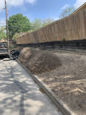 Put sod and river rock with a retaining wall - Sod with retaining wall and river rock