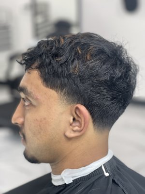 Tapered look - This style of haircut has a tapered look in the sideburn and nape area. you can chose to have it be a low, mid or High tapered look. Also deciding what length to go with on top. Tapered look - This style of haircut has a tapered look in the sideburn and nape area. you can chose to have it be a low, mid or High tapered look. Also deciding what length to go with on top.