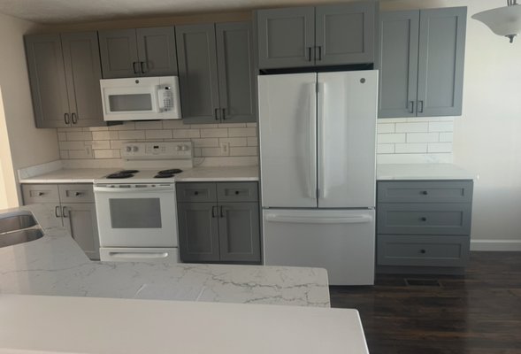 Withe Kitchen - This kitchen was remodeled with white subway backsplash, white marble countertops and beautiful gray kitchen cabinets. Withe Kitchen - This kitchen was remodeled with white subway backsplash, white marble countertops and beautiful gray kitchen cabinets.