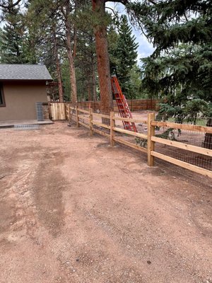 Split Rail Fencing - This split rail fence was built by TNT and complete with turkey wire on the inside to prevent the homeowners dogs from running out of the yard. Split Rail Fencing - This split rail fence was built by TNT and complete with turkey wire on the inside to prevent the homeowners dogs from running out of the yard.
