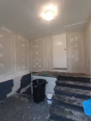 Drywall installation and repair, also repaint. Bay City Michigan - The entrance of this house was destroyed, had to rebuild interior walls, total drywall restoration, and repaint before flooring was installed. Drywall installation and repair, also repaint. Bay City Michigan - The entrance of this house was destroyed, had to rebuild interior walls, total drywall restoration, and repaint before flooring was installed.