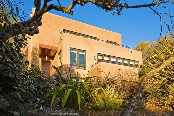 New Hillside Home in San Carlos - A new 4,520 sf (3,722 sf. living area) multi-level home carved into a steep upslope site. The project involved a complex planning entitlement process with initial administrative resistance giving way to acceptance through the Architect’s painstaking coaxing, cajoling, and behind-the-scenes negotiations. Construction of the home required a unique and difficult shoring design in order to retain a pre-existing side wall. Preservation of the side wall was essential for maintaining a non-conforming setback critical to the ultimate livability of the home.
A key challenge of this design was to create spacious light-filled living spaces despite being partially built into the hillside. The design uses many subtle design tools to meet this challenge, including multiple levels stepping up the slope, high ceilings, an open floor plan, and large windows.

Project Credits:
Images: © Craig W. Smith and Ellis A. Schoichet AIA
EASA Architecture: Ellis A. Schoichet AIA and David S. Uldrick
Geotechnical Engineer: PG Soils, Burlingame CA
Structural Engineer: Sung Engineering, Union City CA
Shoring Design: BC|A Engineering, San Carlos CA
Civil Engineer: MacLeod Associates, San Carlos CA
General Contractor: Peter Harris Construction, San Francisco CA (building) 
Earthwork, shoring, foundations: Palo Alto Concrete, Palo Alto
Landscape: Owner
Interior Design: Owner